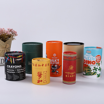 ODMのプラスチック食糧缶は円形シリンダー箱のクラフトのボール紙の包装の上で押す